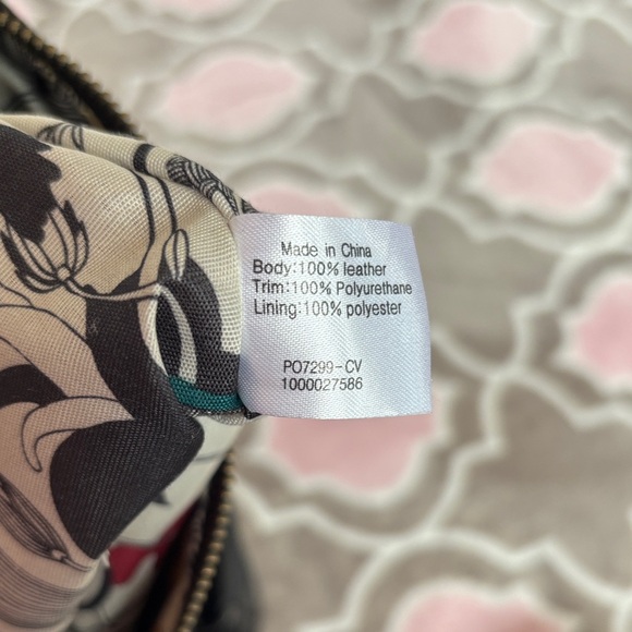 The Sak Black Genuine Leather Tassel Crossbody with Peace Print Interior - Picture 9 of 9